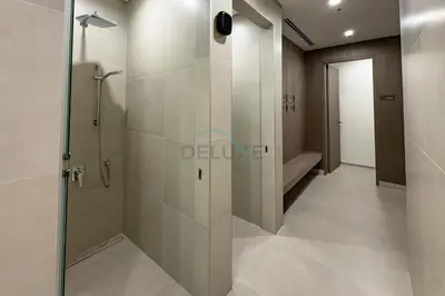 a bathroom with a shower with a glass door at Luxury 1BR with Pool and Stunning Marina Views, Perfectly Located Minutes from the Beach, Tram, and Mall, LIV Marina, Dubai Marina by Deluxe Holiday Homes in Dubai