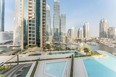 a view of a city skyline with a swimming pool at Luxury 1BR with Pool and Stunning Marina Views, Perfectly Located Minutes from the Beach, Tram, and Mall, LIV Marina, Dubai Marina by Deluxe Holiday Homes in Dubai