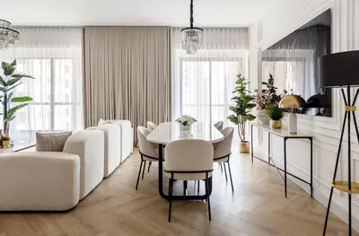 a living room with a white table and chairs at Stylish 1 Bedroom Apartment with Marina View JBR in Dubai