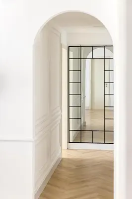 an archway leading into a room with a mirror at Stylish 1 Bedroom Apartment with Marina View JBR in Dubai