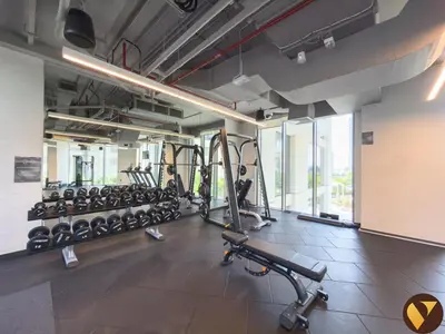a gym with a row of treadmills and machines at Vogue Creek Harbour Icon Bay Waterfront Living Close to Downtown, Burj Khalifa and Dubai Mall, Two Bedroom Apartment with Large Balcony and Canal View, Access to all Amenities in Dubai
