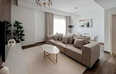 a living room with a couch and a table at Beautiful 2 bed in JBR! bahar in Dubai