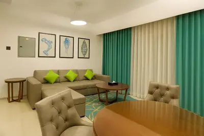 a living room with a couch and a table at City Stay Dubai South - Serviced Apartments in Dubai
