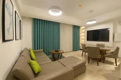 a living room with a couch and a table at City Stay Dubai South - Serviced Apartments in Dubai
