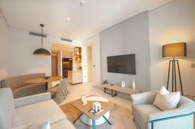 a living room with a couch and a table at Prime Stay Elite, Dubai Mall & Burj Khalifa View in Dubai