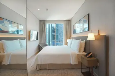 a hotel room with a large bed and a window at Prime Stay Elite, Dubai Mall & Burj Khalifa View in Dubai