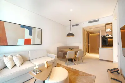 a living room with a couch and a table at Prime Stay Elite, Dubai Mall & Burj Khalifa View in Dubai
