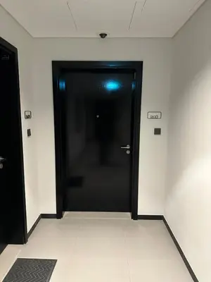 a black door in a room with white walls at Great 1 bed apart close to Burj Khalifa and Dubai Mall in Dubai