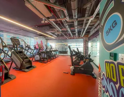 a gym with several treadmills and cardio machines at Luxurious High-Floor 3BR with Assistant Room, Showcasing Lake & City Views, Just Moments Drive from JBR Beaches and Ain Dubai, MBL Royal, JLT by Deluxe Holiday Homes in Dubai