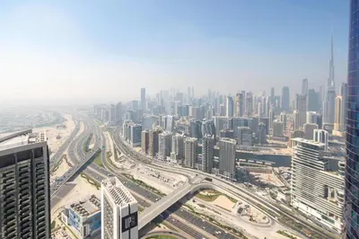 an aerial view of a city with tall buildings at Frank Porter - Paramount Tower A in Dubai