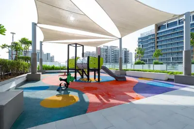 a play area with a playground in a building at Modern Studio in Azizi Riviera 46 with Pool, Gym & Free Parking in Dubai