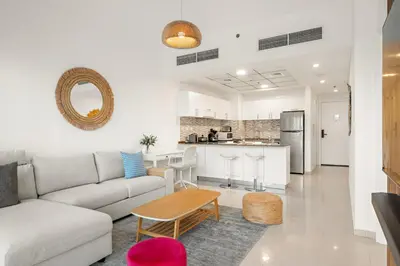 a living room with a couch and a table at FIRST CLASS 1BR Scenic Marina Views in Dubai