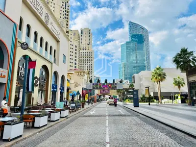 a street in a city with tall buildings at New & Beautiful 1BD Apartment in Address JBR in Dubai