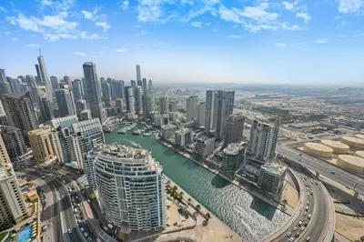 an aerial view of a city with a river and buildings at New & Beautiful 1BD Apartment in Address JBR in Dubai