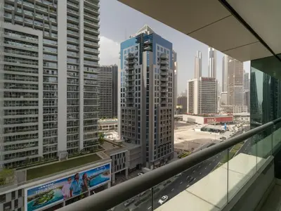a view of the city from the balcony of a building at Water Edge Damac Maison Canal View 1BR Perfect Grand Getaway in Dubai