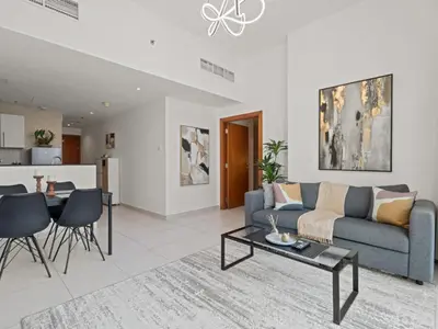 a living room with a couch and a table at Prime Luxe 1BR w SofaBed -Sleeps 4 - In Marina View in Dubai
