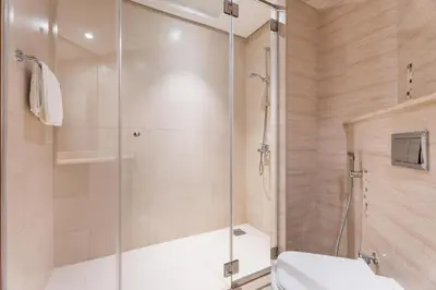 a bathroom with a shower and a toilet at GuestReady - 1 BHK | Breathtaking Skyline Views in Dubai