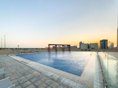 a swimming pool on the roof of a building at GuestReady - 1 BHK | Breathtaking Skyline Views in Dubai