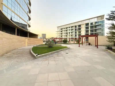 an empty courtyard in front of a building at GuestReady - 1 BHK | Breathtaking Skyline Views in Dubai