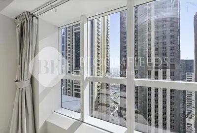 a room with a large window with a view of the city at Bloomfields Iconic 2BR Elite Residence Marina in Dubai