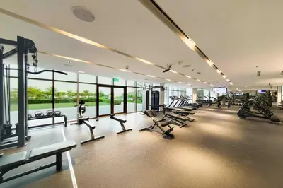 a gym with a lot of treadmills and chairs in it at Palm Jumeirah, Fancy 2 Bedroom suite! in Dubai