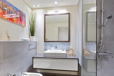 a bathroom with a sink and a shower at Upscale Studio in Park View JVC in Dubai