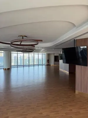an empty room with a large hall with wood floors and a ceiling at Magical Views Downtown Lux 2 BR Urban Resort in Dubai