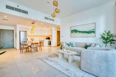 a living room with a couch and a table at PVH - Serene Central 2BR - Creek Horizon in Dubai