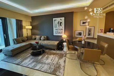 a living room with a couch and a table at EEHH 1BR - 8 day NYE festival - Paramount - for 4 in Dubai