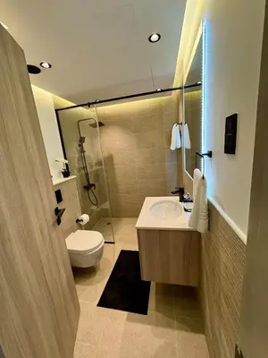 a bathroom with a sink and a toilet and a shower at Brand New Luxury Home in a prime location in Dubai
