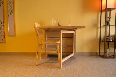 a table and two chairs sitting next to a desk at Meydan Boutique Loft Near Downtown in Dubai