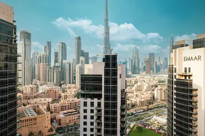 a view of a large city with tall buildings at Enjoy 8-Day NYE Spectacles with Burj Khalifa View in Dubai