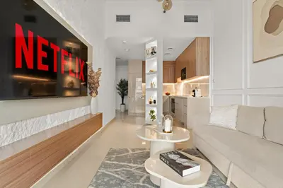 a living room with a couch and a table at VayK - Vibrant and Great 1BR in the Marina in Dubai