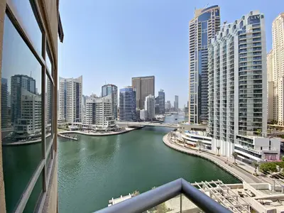 a view of a river in a city with buildings at VayK - Exquisite 2BR with Panoramic Marina View in Dubai