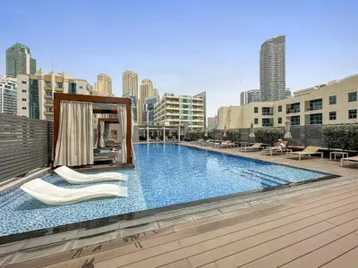 a large swimming pool on top of a building at VayK - Bright and Stylish 1BR in Marina in Dubai