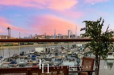 a view of a marina with boats in a harbor at LUX The Palm Sea View Studio in Dubai