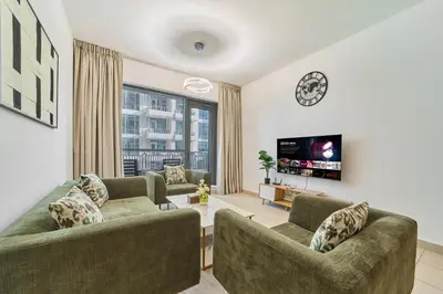 a living room with two couches and a tv at Golden Homes Aqua Bay 1BR-BLVD CENTRAL Downtown Dubai mall in Dubai