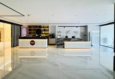a lobby with a reception desk in a building at Luxury Studio Apartment Near Jumeirah Beach in Dubai