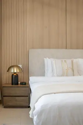 a bedroom with a bed and a table with a lamp at Airstay - Stunning 2BR Marina View Retreat - JBR - Monthly Offer Available! in Dubai