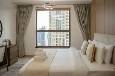 a bedroom with a large bed with a large window at Airstay - Stunning 2BR Marina View Retreat - JBR - Monthly Offer Available! in Dubai