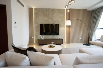 a living room with white furniture and a flat screen tv at Airstay - Stunning 2BR Marina View Retreat - JBR - Monthly Offer Available! in Dubai