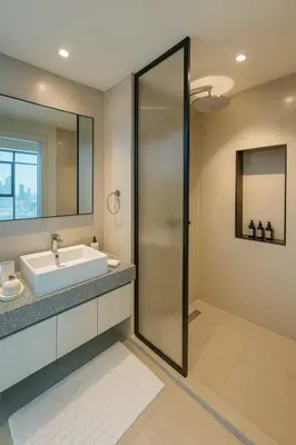 a bathroom with a sink and a shower at Marina Vista 2BR High Floor Sea View Emaar Beachfront in Dubai