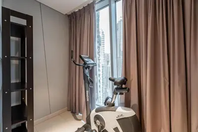 a room with a vacuum in front of a window at GuestReady - 2BR l Marina View + Infinity Pool in Dubai