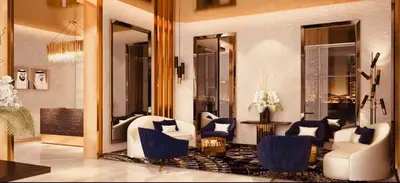 a living room with white furniture and blue chairs at Premium Guest - Majestine Downtown Luxe in Dubai