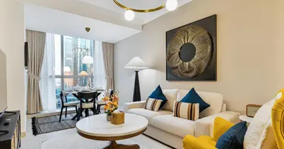 a living room with a couch and a table at Lake View 1BHK in JLT Next to Metro in Dubai