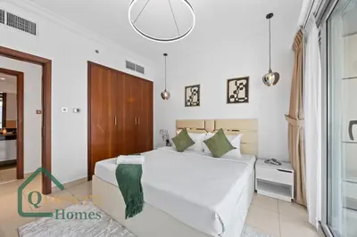 a bedroom with a large white bed in a room at Skyline Bliss Luxury Apartment Dubai in Dubai