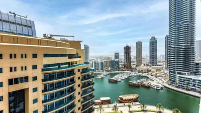 a view of a river in a city with buildings at Sparkle Tower by Swarovski, Premium Full Marina View, 2min JBR & Metro, Sleeps 4 in Dubai