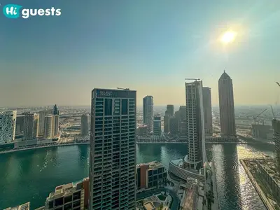 a view of a city with a river and buildings at HiGuests - High Rise Studio Haven in Business Bay in Dubai