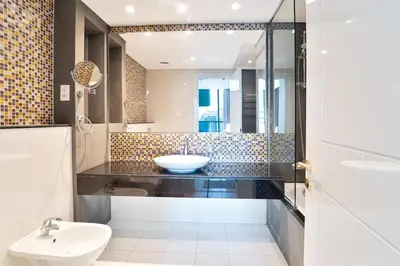 a bathroom with a sink and a toilet at Refined 1 bedroom - Upper Crest - Near Dubai Mall in Dubai
