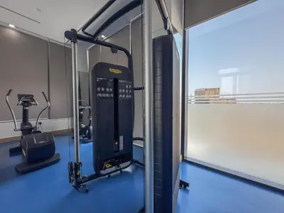 a gym with a tread machine in a room at Vogue Dubai Hills The Pinnacle near Dubai Hills Mall and Park, One Bedroom Apartment with Large Balcony and City View, Access to all Amenities in Dubai